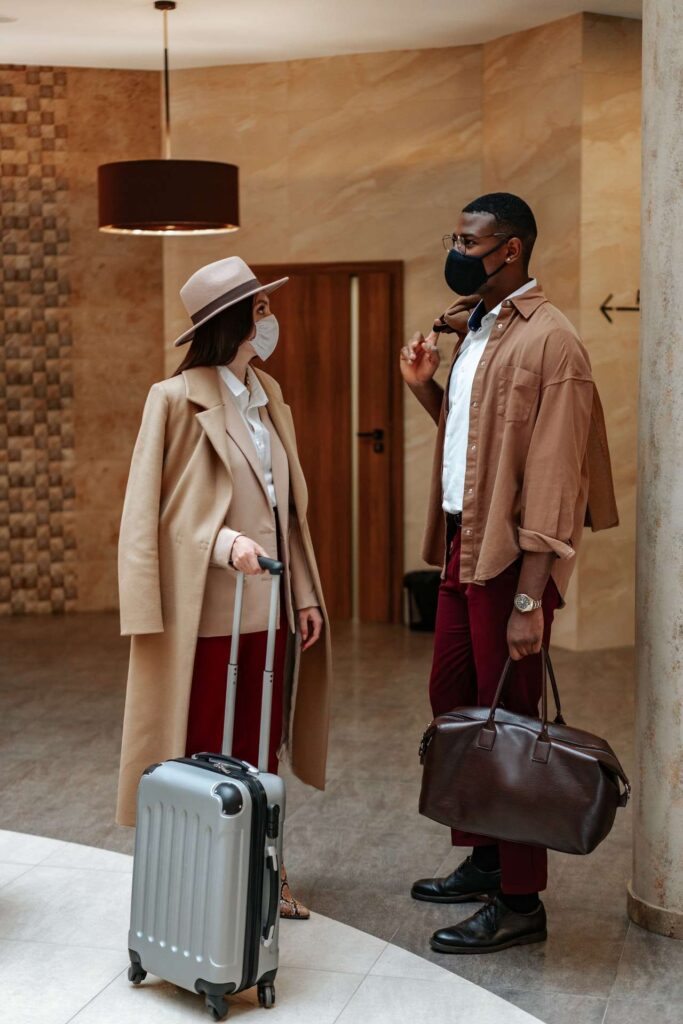 a man and a girl standing with a suitcase before an LGA to JFK transfer