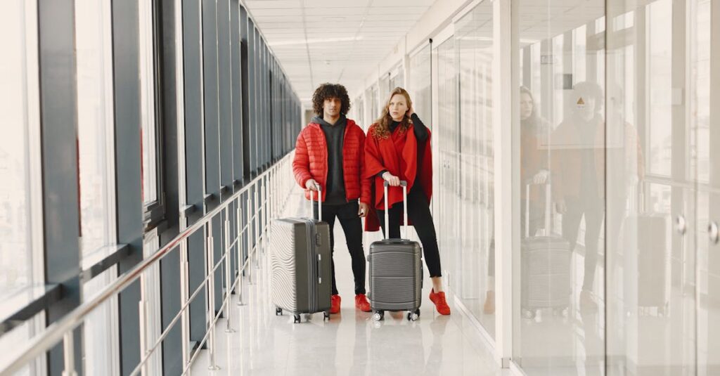 Woman and man standing at the airport with travel luggage.