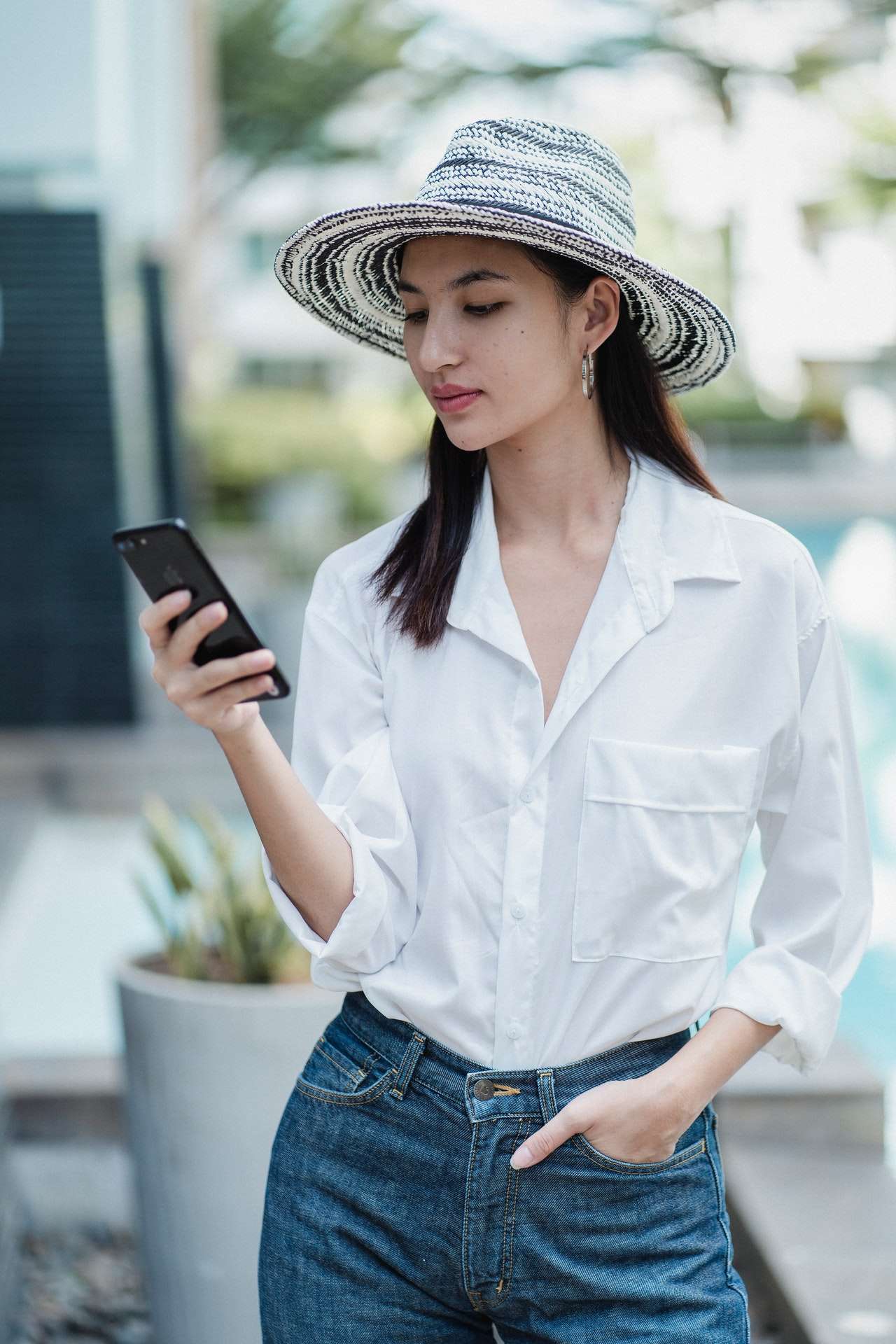 Traveler reviewing flight details and a destination address on a phone